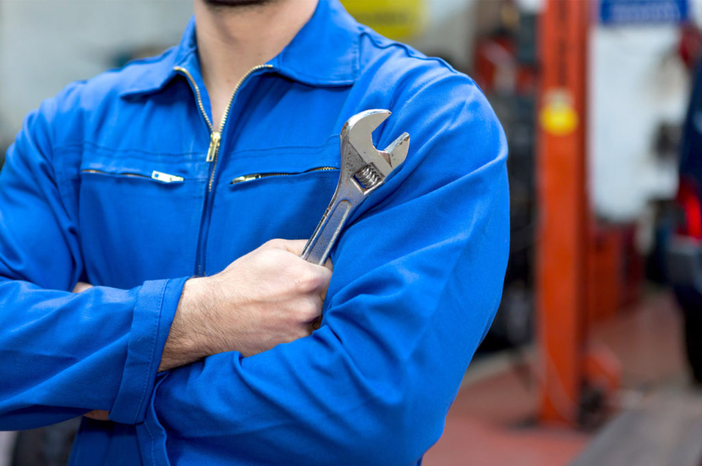 Mechanic holding wrench